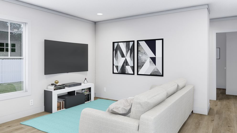 The STILL THE ONE Living Room. This Manufactured Mobile Home features 2 bedrooms and 2 baths.