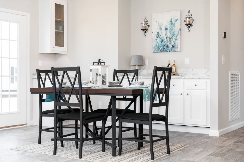 The SUPER 68 ELITE Dining Area. This Manufactured Mobile Home features 3 bedrooms and 2 baths.