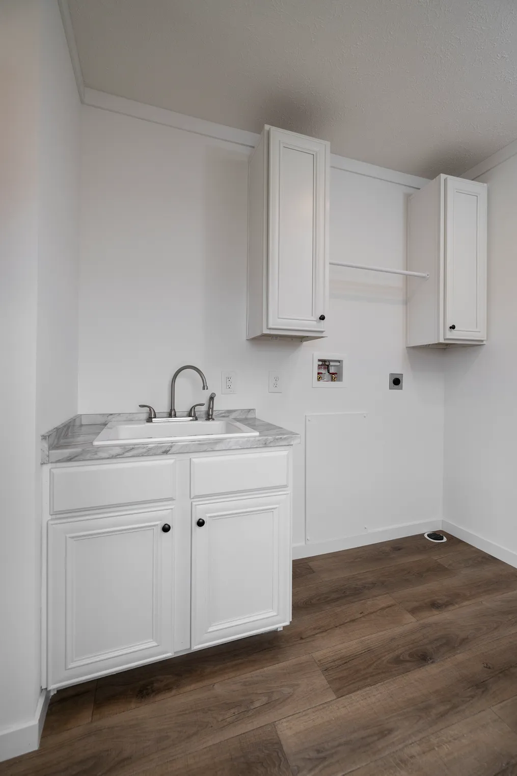 The THE ANNA FAE Utility Room. This Manufactured Mobile Home features 3 bedrooms and 2 baths.