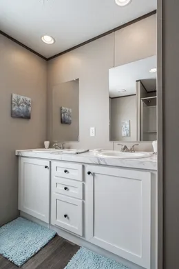 The FARMHOUSE BREEZE 72 Guest Bathroom. This Manufactured Mobile Home features 4 bedrooms and 2 baths.