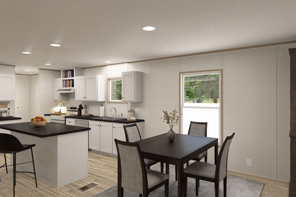 The THE EAGLE 76 Dining Area. This Manufactured Mobile Home features 5 bedrooms and 2 baths.