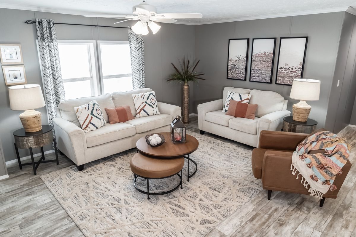 The CASCADE Living Room. This Manufactured Mobile Home features 4 bedrooms and 2 baths.