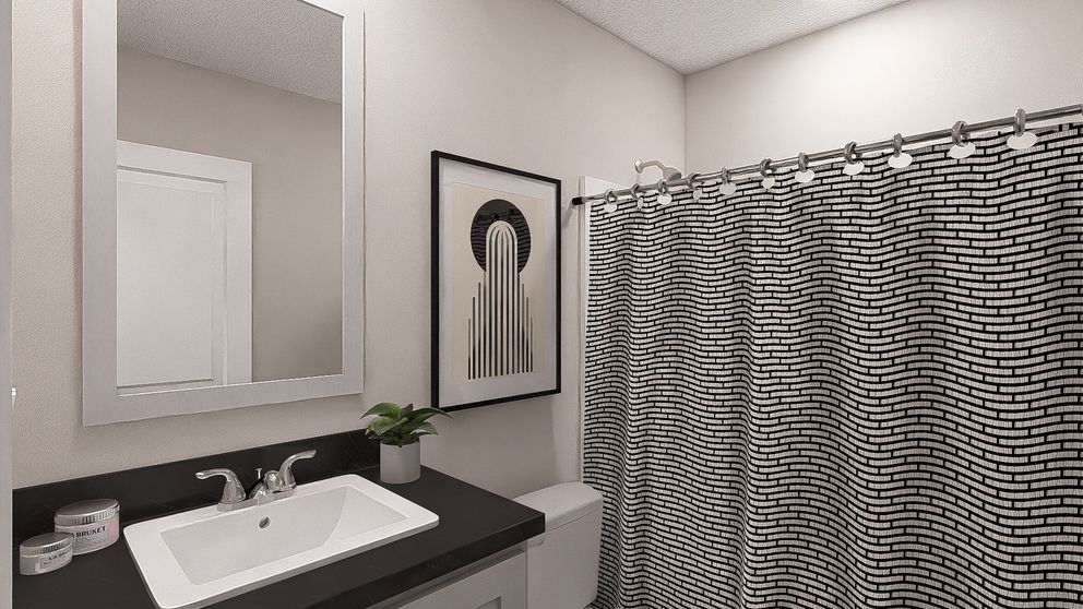 The HERE COMES THE SUN Guest Bathroom. This Manufactured Mobile Home features 3 bedrooms and 2 baths.