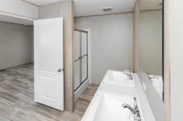 The THE ANNIVERSARY ISLANDER Primary Bathroom. This Manufactured Mobile Home features 3 bedrooms and 2 baths.