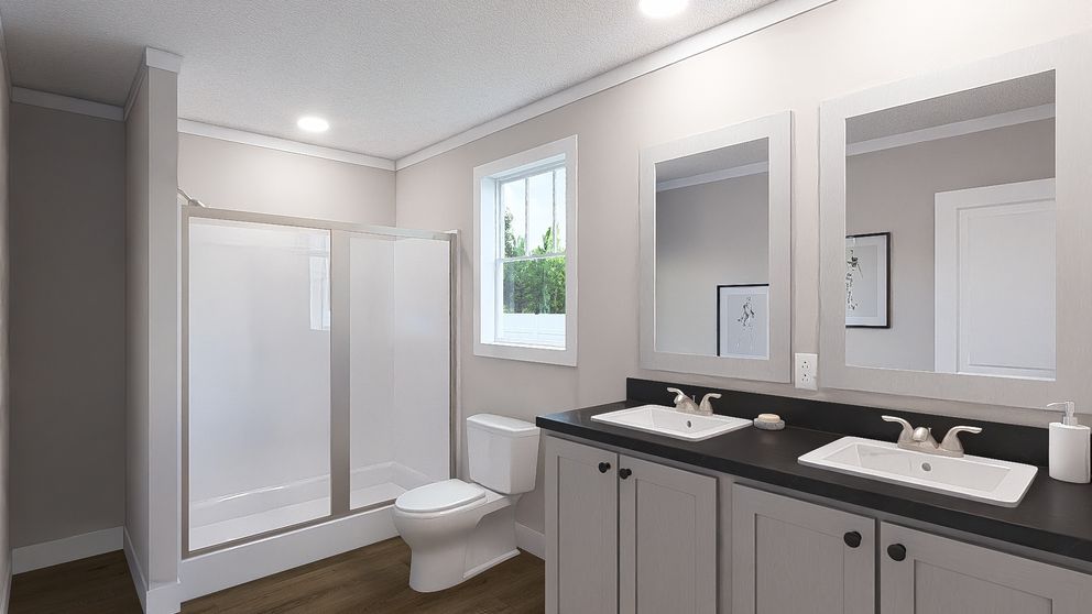 The UNDER PRESSURE Primary Bathroom. This Manufactured Mobile Home features 3 bedrooms and 2 baths.
