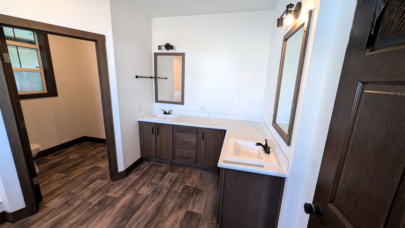The LEGEND 402 MOD Primary Bathroom. This Modular Home features 3 bedrooms and 2 baths.