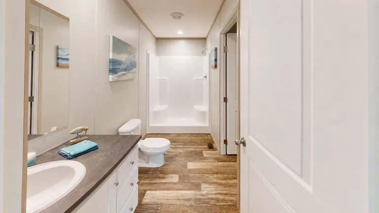 The HANCOCK Primary Bathroom. This Manufactured Mobile Home features 4 bedrooms and 2 baths.