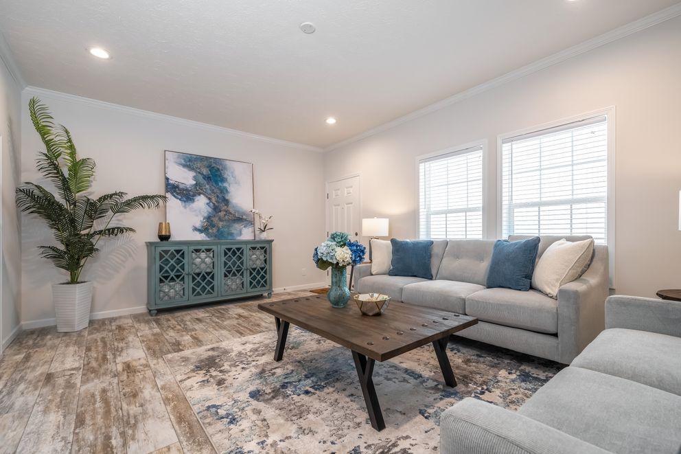 The 1444 CAROLINA Living Room. This Manufactured Mobile Home features 4 bedrooms and 2 baths.