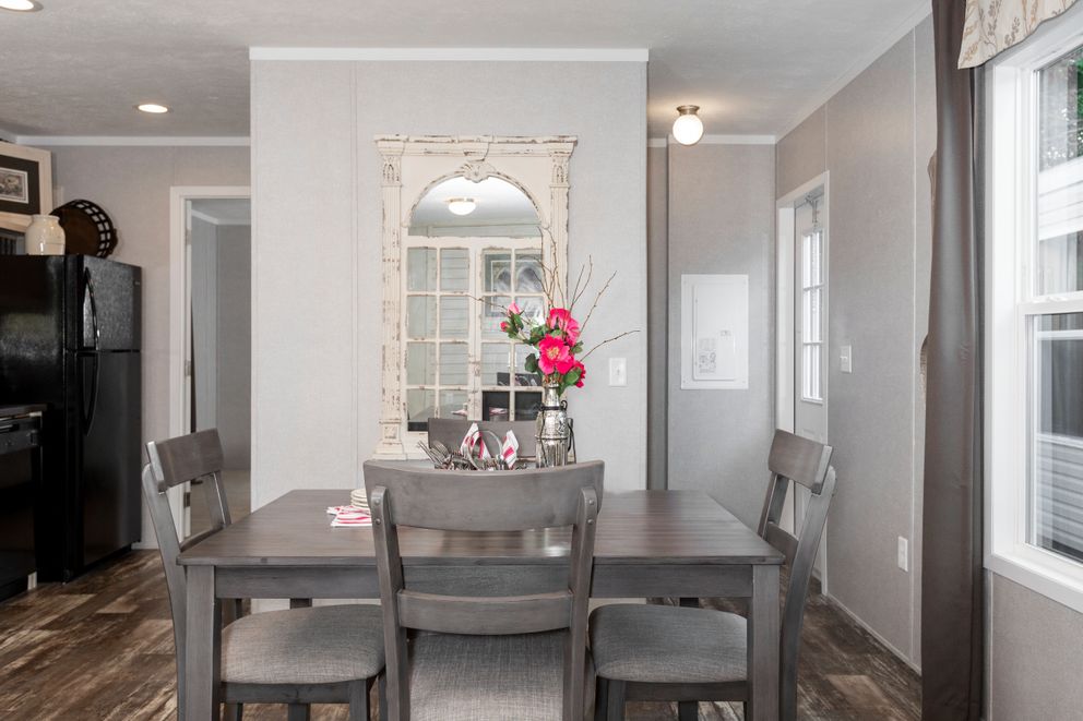 The SAPPHIRE Dining Room. This Manufactured Mobile Home features 3 bedrooms and 2 baths.