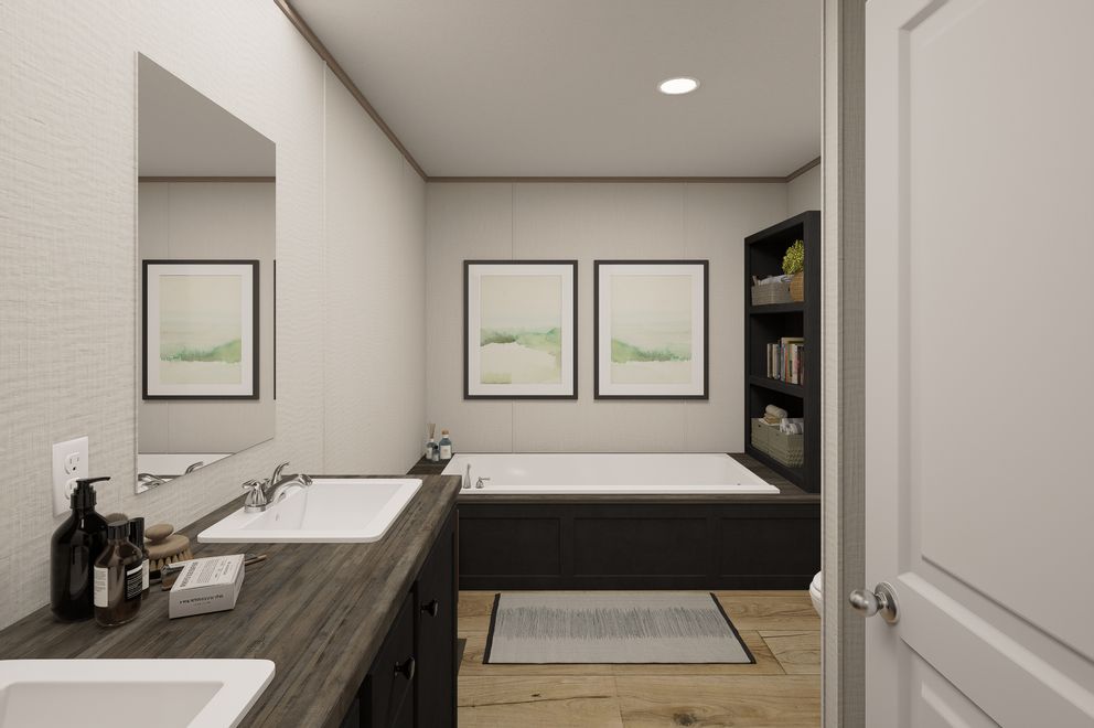 The ULTRA FLEX Primary Bathroom. This Manufactured Mobile Home features 4 bedrooms and 2 baths.