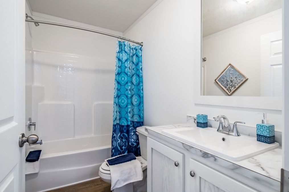 The SUNDANCE 48B Guest Bathroom. This Manufactured Mobile Home features 3 bedrooms and 2 baths.