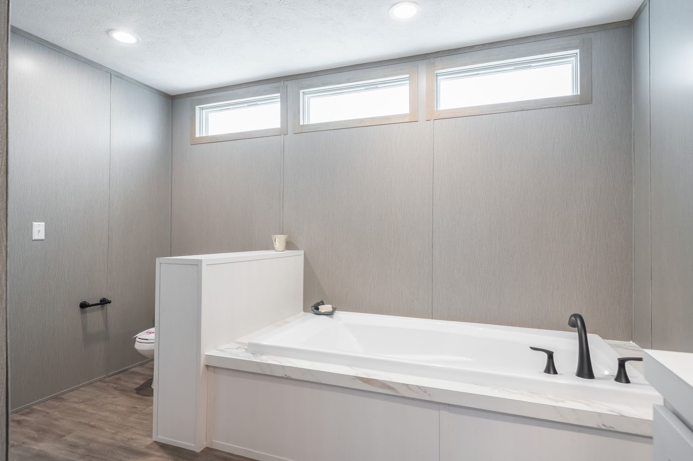 The BLUEBONNET BREEZE Primary Bathroom. This Manufactured Mobile Home features 3 bedrooms and 2 baths.