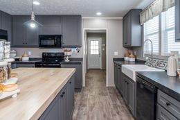The TRADITION 3268B Kitchen. This Manufactured Mobile Home features 5 bedrooms and 3 baths.