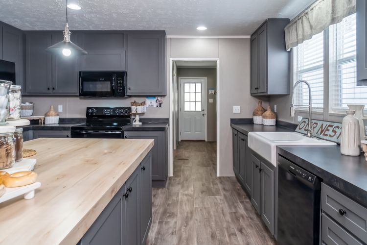 The TRADITION 3268B Kitchen. This Manufactured Mobile Home features 5 bedrooms and 3 baths.