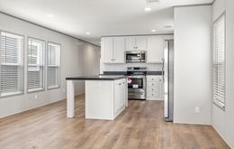 The PORCH LIVING SERIES 16682A Kitchen. This Manufactured Mobile Home features 2 bedrooms and 2 baths.