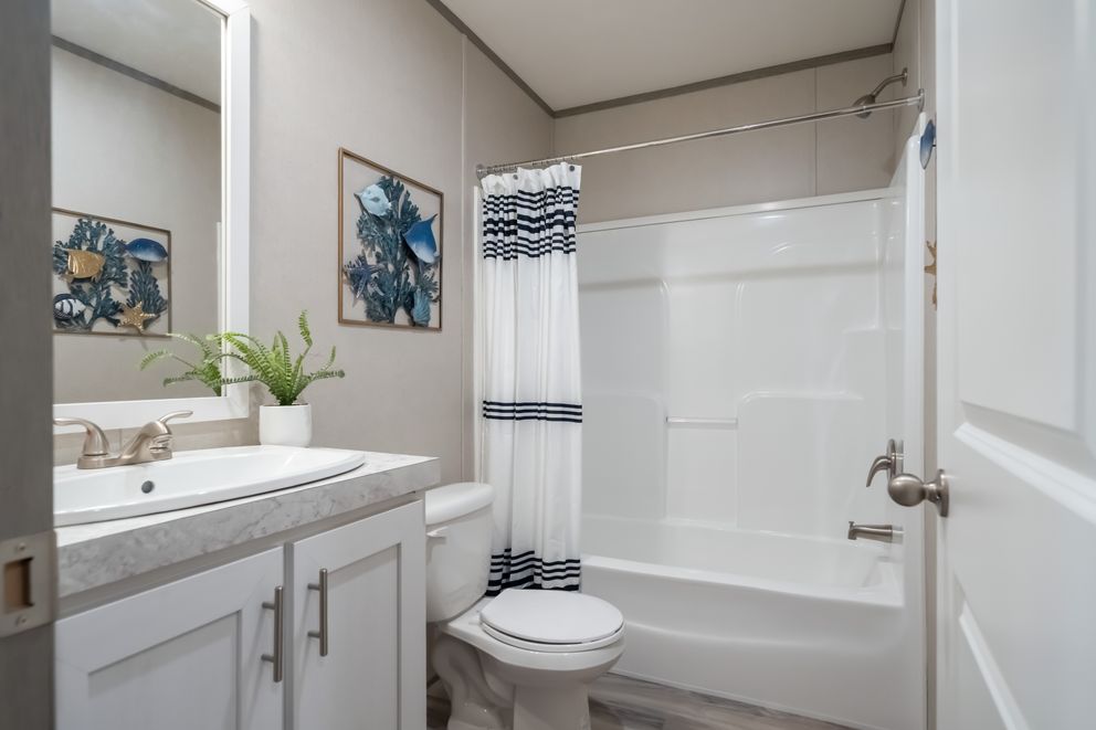 The TRADITION 48F Guest Bathroom. This Manufactured Mobile Home features 3 bedrooms and 2 baths.