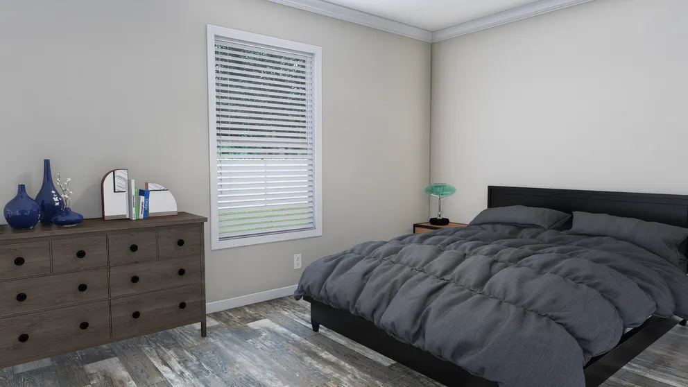 The CAROLINIAN M5000 Bedroom. This Manufactured Mobile Home features 3 bedrooms and 2 baths.