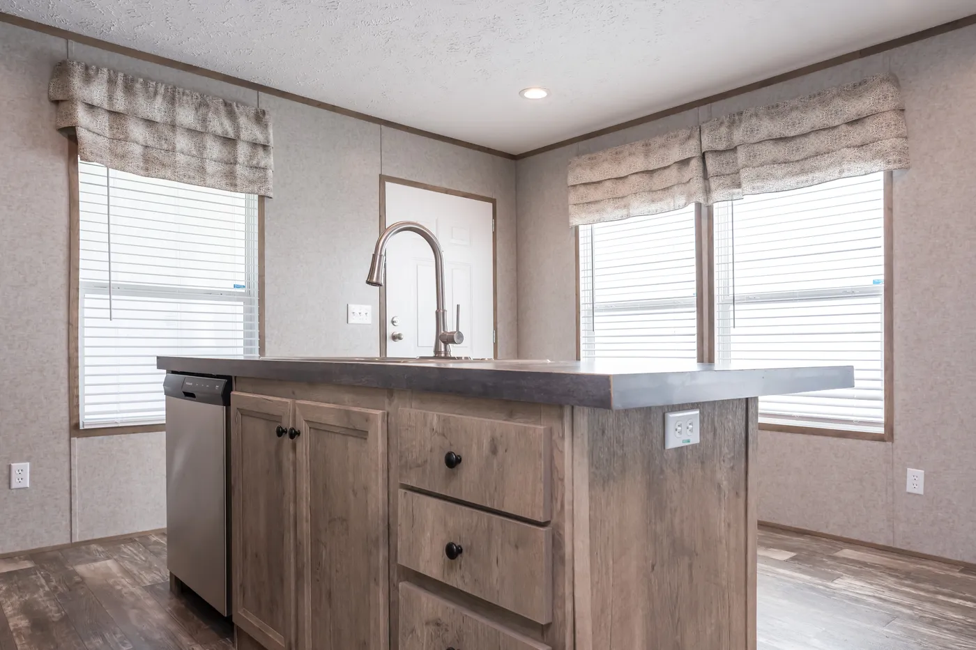 The LAKESIDE COTTAGE Kitchen. This Manufactured Mobile Home features 1 bedroom and 1 bath.