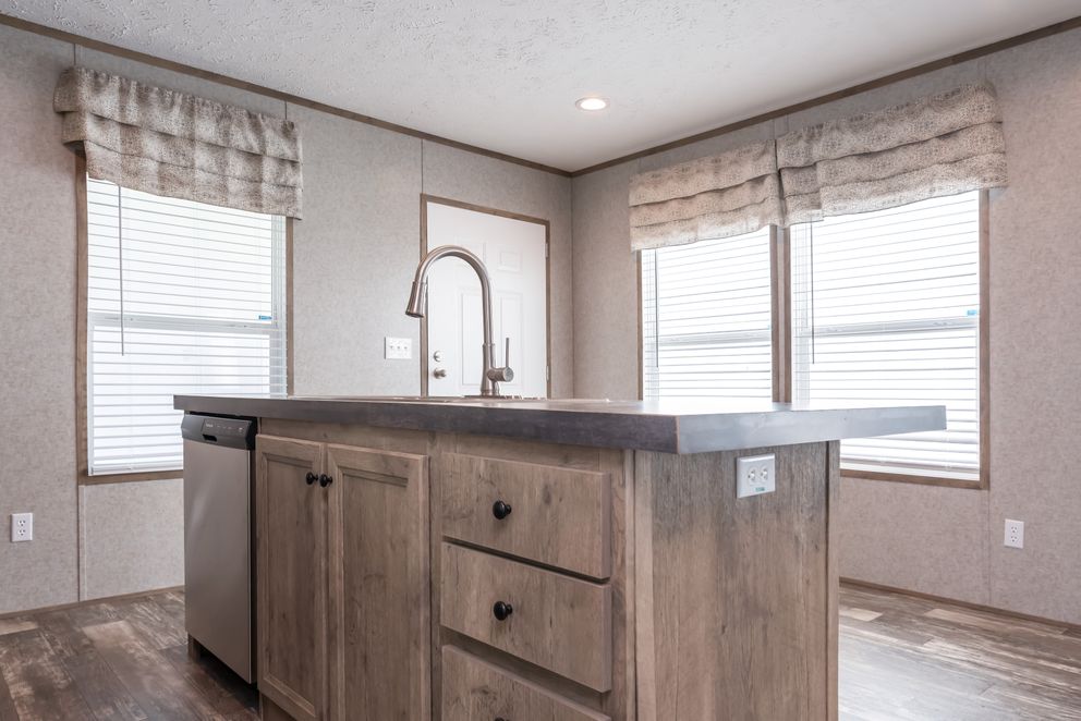 The LAKESIDE COTTAGE Kitchen. This Manufactured Mobile Home features 1 bedroom and 1 bath.