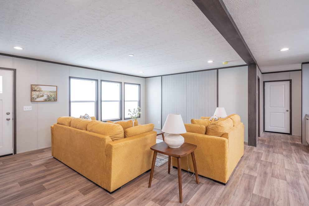 The EMPOWER Living Room. This Manufactured Mobile Home features 4 bedrooms and 2 baths.