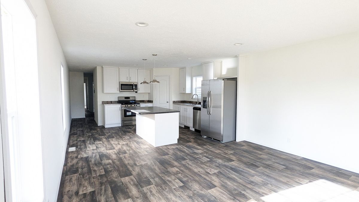 The LIFESTYLE 217 Dining Area. This Manufactured Mobile Home features 3 bedrooms and 2 baths.