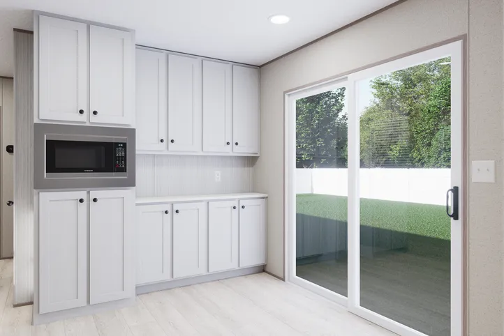 The THE ANNIVERSARY 76 Dining Room. This Manufactured Mobile Home features 3 bedrooms and 2 baths.