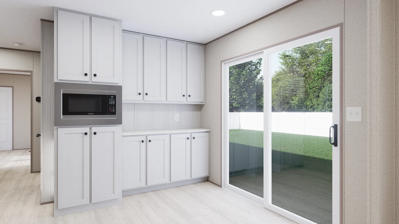 The THE ANNIVERSARY 76 Dining Room. This Manufactured Mobile Home features 3 bedrooms and 2 baths.