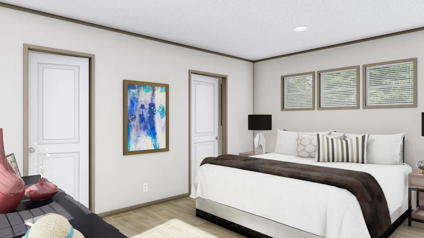 The MAGELLAN Primary Bedroom. This Manufactured Mobile Home features 3 bedrooms and 2 baths.