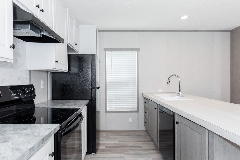 The BLAZER 66 F Kitchen. This Manufactured Mobile Home features 3 bedrooms and 2 baths.