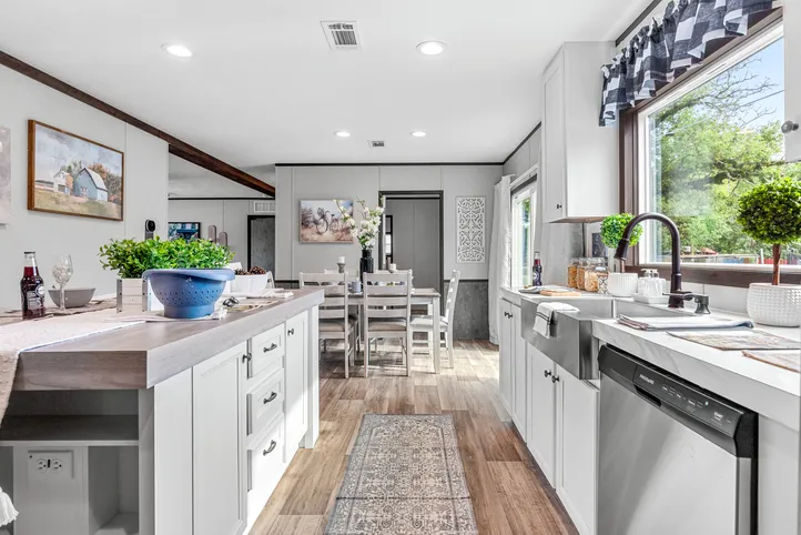 The THE ANNIVERSARY 2.1 Kitchen. This Manufactured Mobile Home features 3 bedrooms and 2 baths.