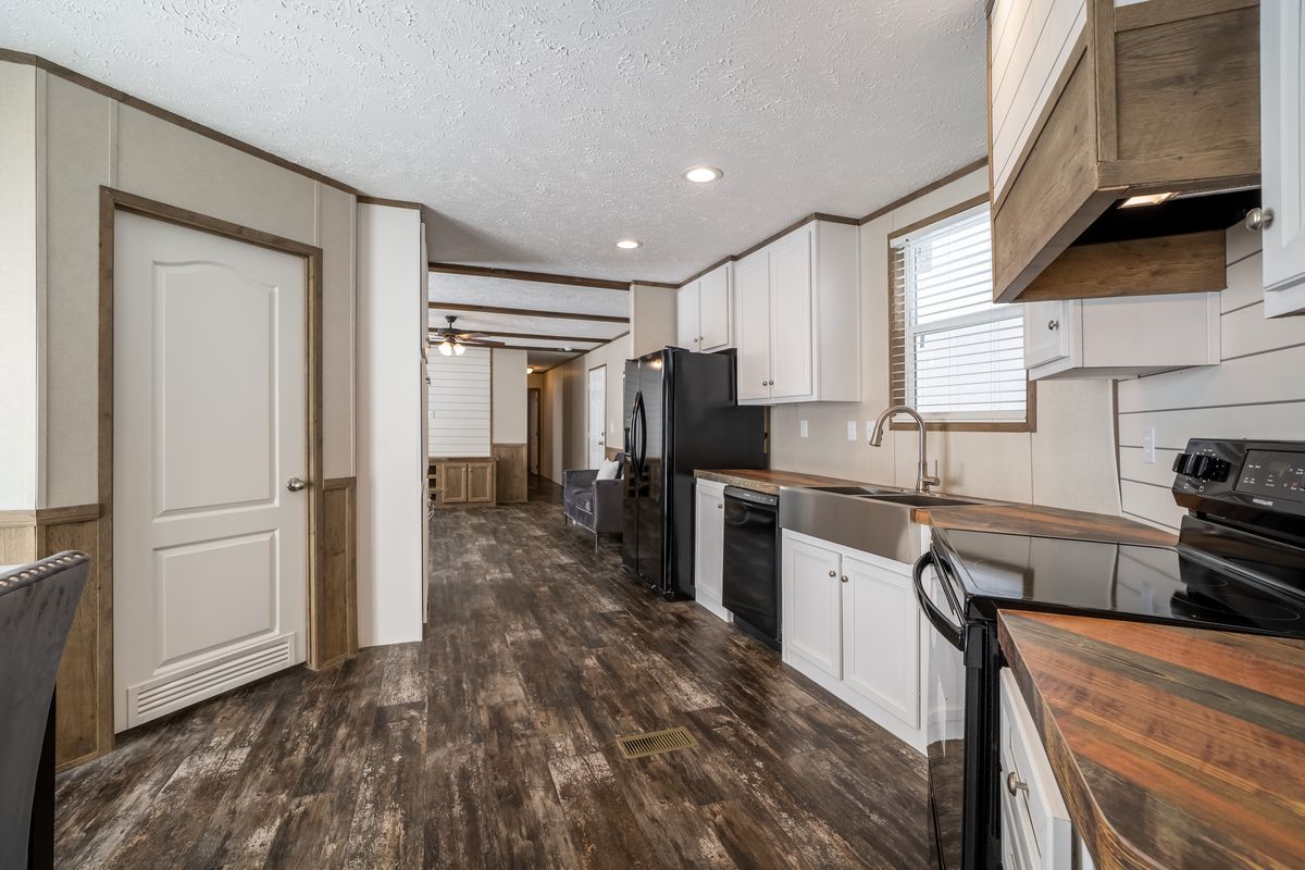 The ANNIVERSARY ENTERTAINER Exterior. This Manufactured Mobile Home features 3 bedrooms and 2 baths.
