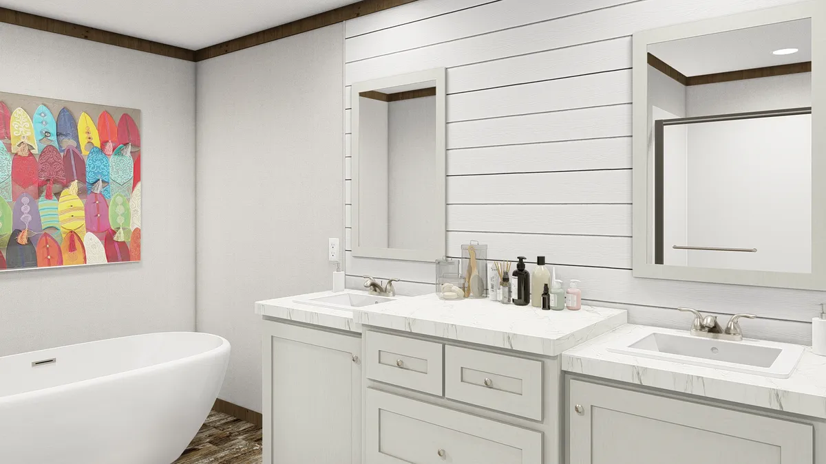 The HOMESTEAD BREEZE Primary Bathroom. This Manufactured Mobile Home features 4 bedrooms and 2 baths.