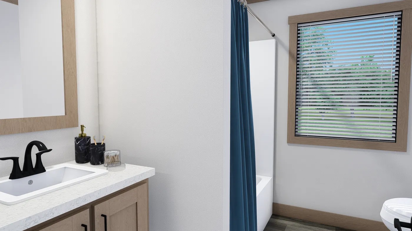 The TINSLEY Guest Bathroom. This Manufactured Mobile Home features 4 bedrooms and 2 baths.