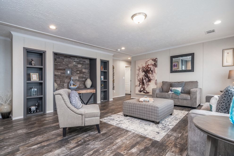 The ALL AMERICAN Living Room. This Manufactured Mobile Home features 3 bedrooms and 2 baths.