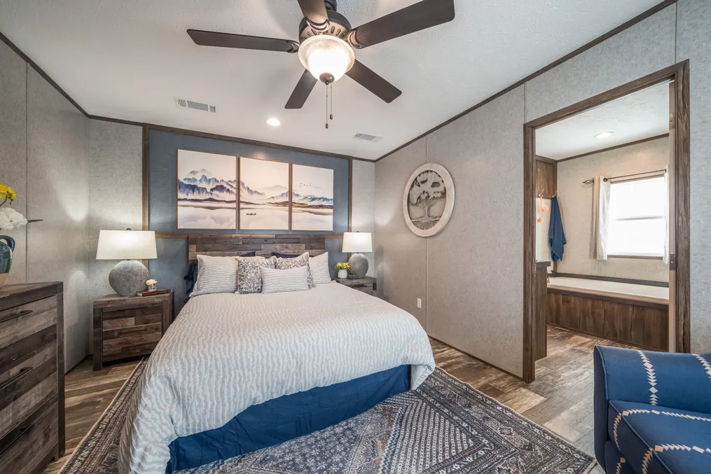 The LIBERTY Primary Bedroom. This Manufactured Mobile Home features 3 bedrooms and 2 baths.