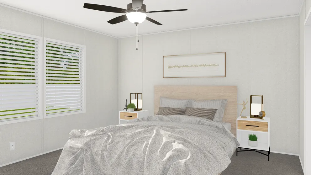 The GRAND LIVING 76 Primary Bedroom. This Manufactured Mobile Home features 4 bedrooms and 2 baths.