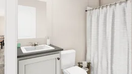 The THE ANNIVERSARY PLUS Guest Bathroom. This Manufactured Mobile Home features 3 bedrooms and 2 baths.