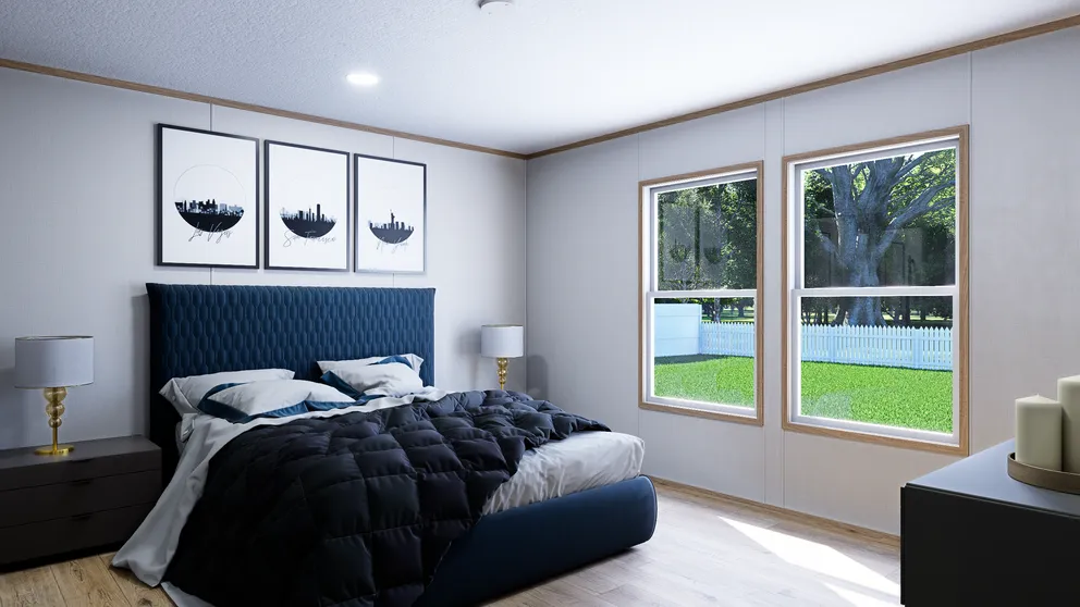 The SOLACE Primary Bedroom. This Manufactured Mobile Home features 4 bedrooms and 2 baths.