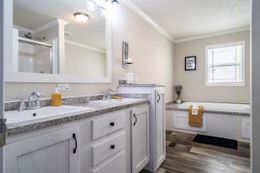 The BROOKLINE FLEX 32 WIDE Master Bathroom. This Manufactured Mobile Home features 4 bedrooms and 3 baths.