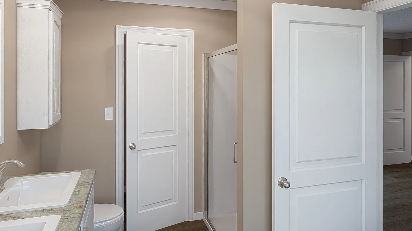 The THE DREAM Primary Bathroom. This Manufactured Mobile Home features 3 bedrooms and 2 baths.