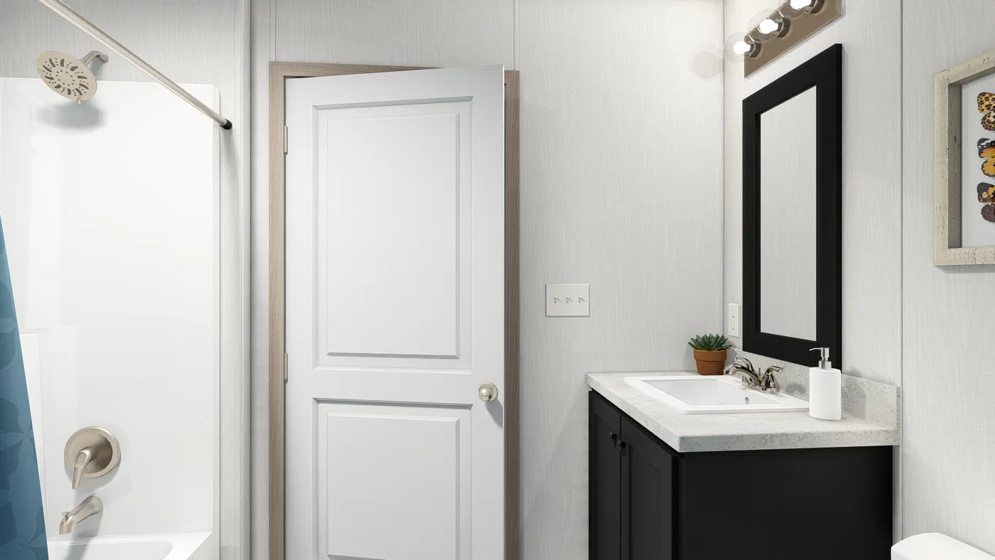 The 7616-4714 THE PULSE Primary Bathroom. This Manufactured Mobile Home features 3 bedrooms and 2 baths.