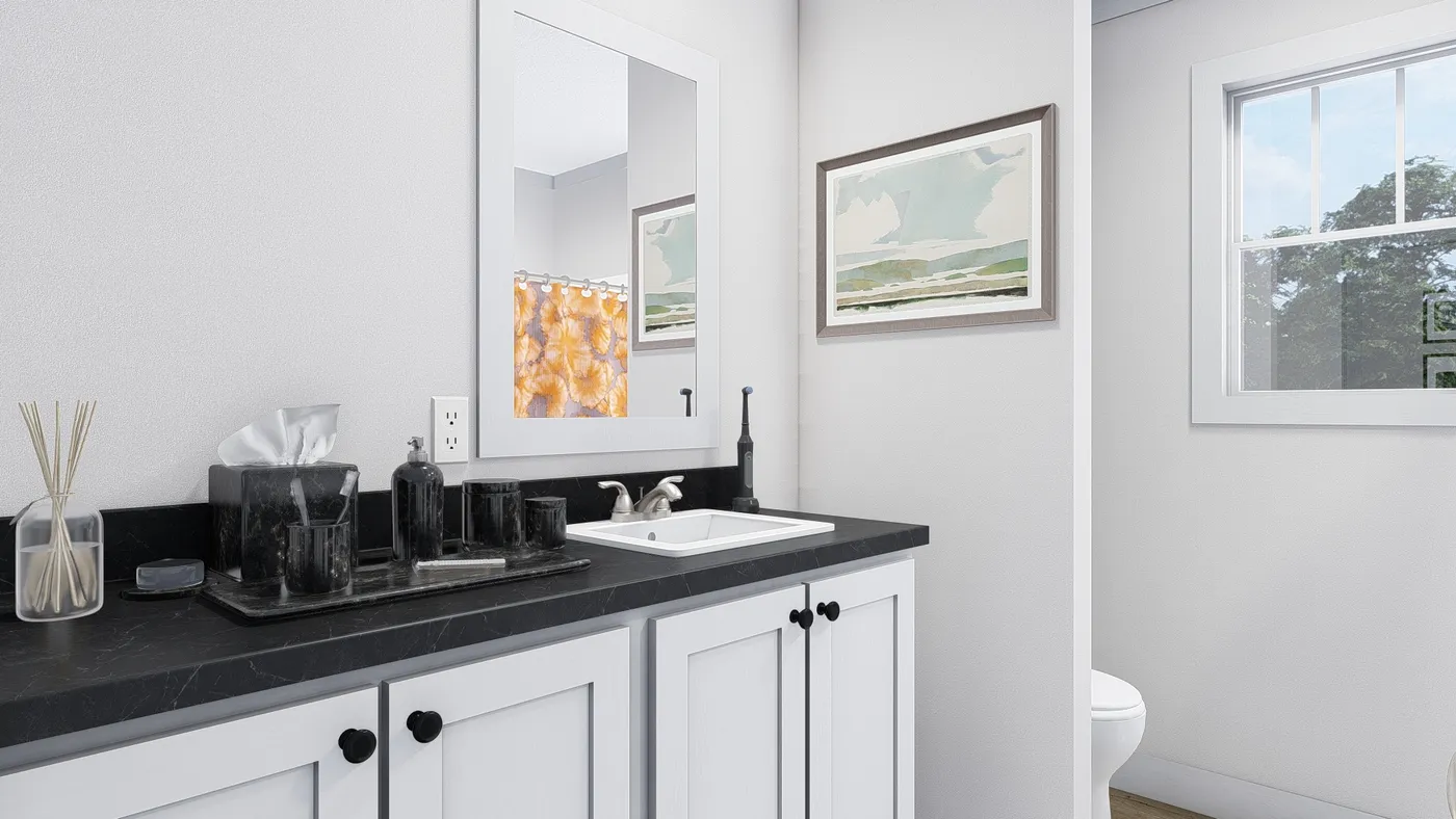The HEY JUDE Guest Bathroom. This Manufactured Mobile Home features 4 bedrooms and 2 baths.
