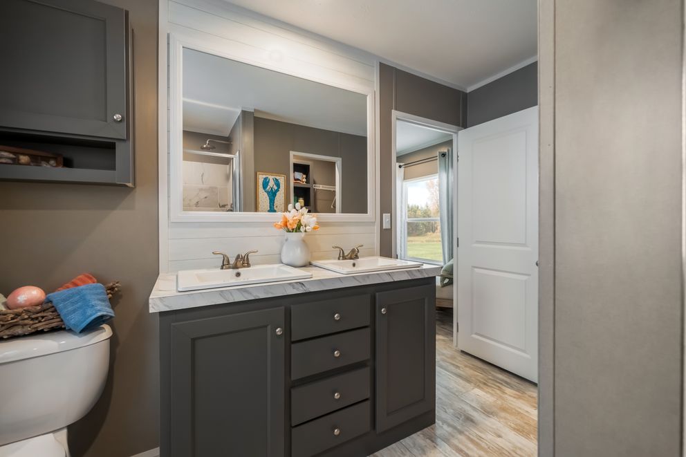 The THE DRIFTWOOD Primary Bathroom. This Manufactured Mobile Home features 3 bedrooms and 2 baths.