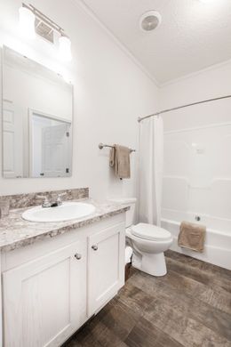 The 1558 JAMESTOWN Guest Bathroom. This Manufactured Mobile Home features 3 bedrooms and 2 baths.