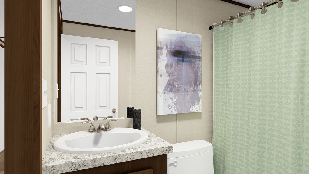 The GRAND Guest Bathroom. This Manufactured Mobile Home features 4 bedrooms and 2 baths.