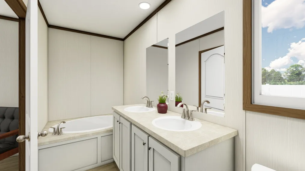 The ESSENCE Primary Bathroom. This Manufactured Mobile Home features 3 bedrooms and 2 baths.