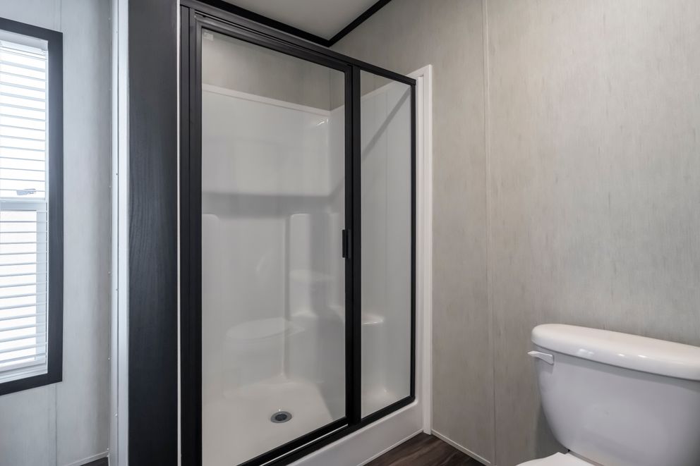 The LIL SOUTHERN CHARM Primary Bathroom. This Manufactured Mobile Home features 3 bedrooms and 2 baths.