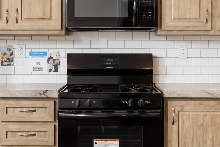 The FAIRPOINT 20382B Kitchen. This Manufactured Mobile Home features 2 bedrooms and 2 baths.