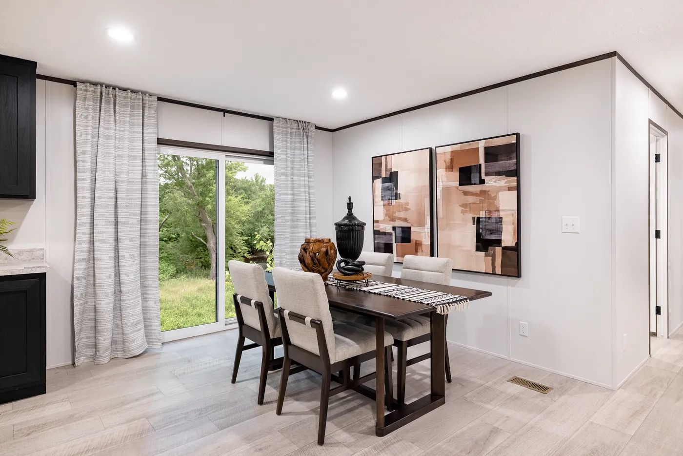 The CRESTWOOD Dining Room. This Manufactured Mobile Home features 3 bedrooms and 2 baths.