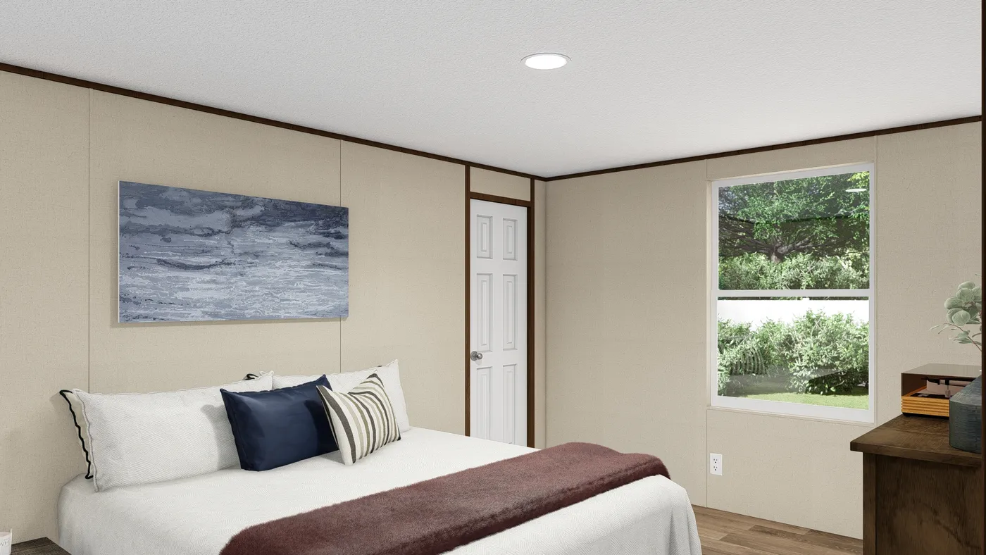 The THRILL Primary Bedroom. This Manufactured Mobile Home features 3 bedrooms and 2 baths.